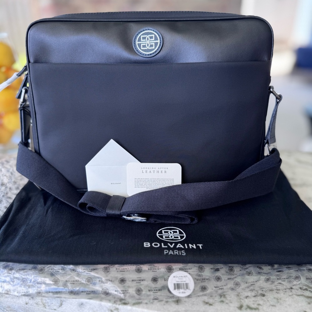 Graphite Blue/Black Trim Laptop Bag with Adjustable Strap and Textured Fabric.